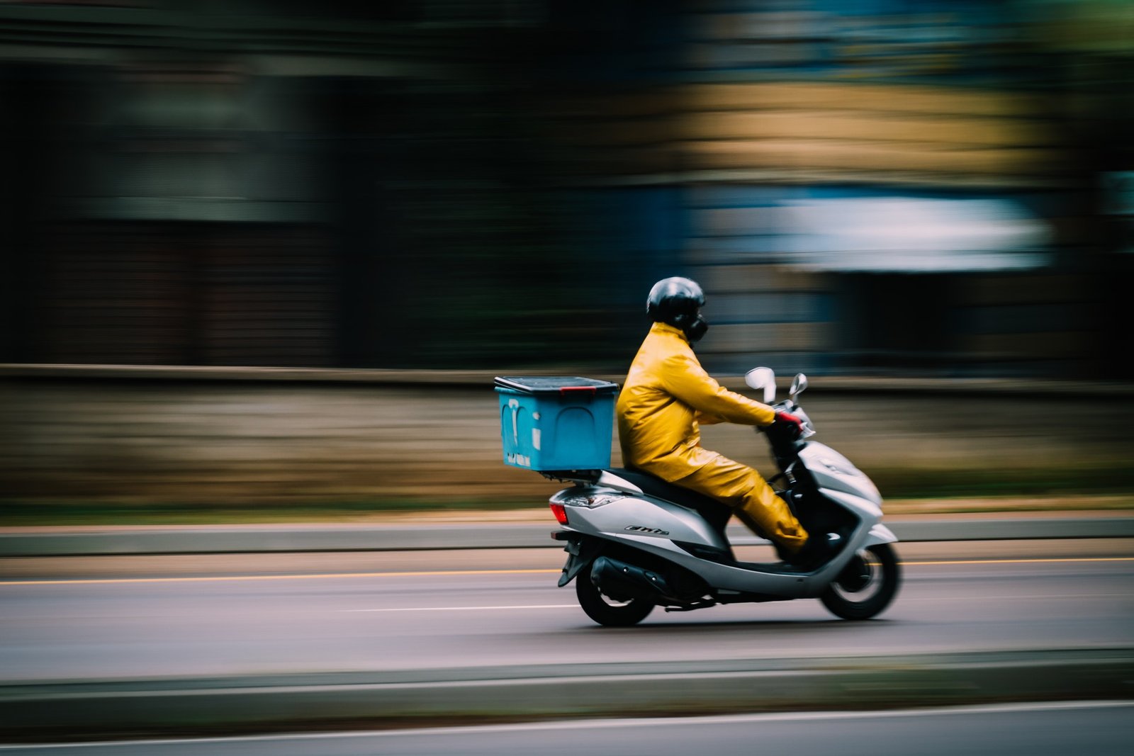 man-in-yellow-clothes-riding-motorcycle